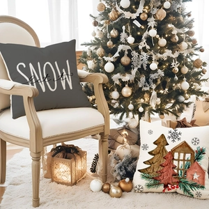 Christmas tree and cabin linen pillowcases on a cozy wooden chair in warm interior