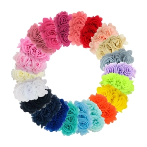 Colorful chiffon rose hair clips for girls arranged in a vibrant circular pattern