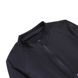 Close-up of the zipper and stand-up collar on a black athletic long sleeve bodysuit