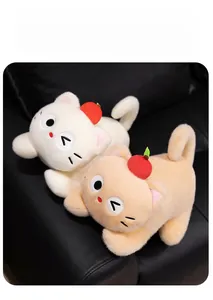 Detail of plush cat toy with apple hat showing soft texture and premium filling