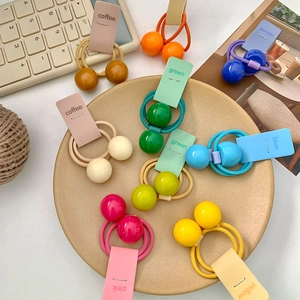 Colorful double ball elastic hair ties for girls in various pastel shades for ponytails