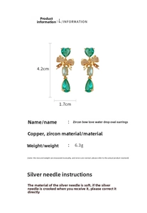 Detail of emerald zircon bow heart drop earrings with dimensions and material specs