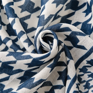 Detail of blue and white houndstooth fabric showing soft texture and woven pattern