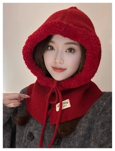 Detail of red knit balaclava hooded scarf with warm fleece lining and button closure