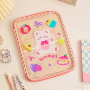 Pink cartoon iPad sleeve with transparent PVC window and mesh pocket detail