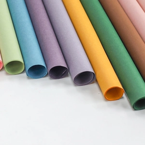 Rolls of colorful waterproof floral wrapping paper arranged in a neat diagonal pattern