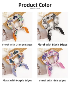 Detail view of four colorful floral silk scarves on wooden display boards with geometric patterns