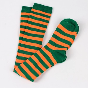 Flat lay of soft green and orange striped over-knee socks on a white background