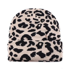Classic leopard print knitted beanie in beige and black for winter warmth and outdoor style