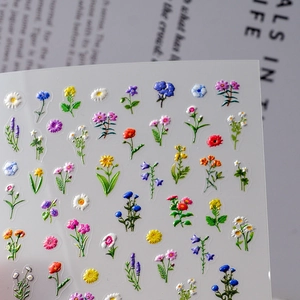 5D embossed floral nail art stickers featuring 3D daisies and tulips for DIY manicure