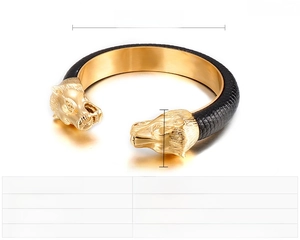 Close-up of golden wolf head bangle with black leather detailing and 61x12mm dimensions