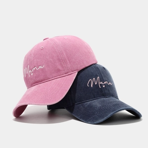Washed cotton baseball caps in pink and navy blue with embroidered Mama heart text