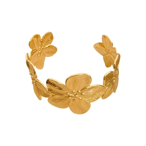 Elegant gold flower cuff bracelet featuring five textured blossoms in a minimalist open design