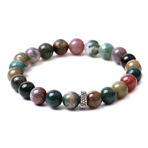 Detailed close-up of tiger eye and matte agate beads with a silver filigree spacer charm