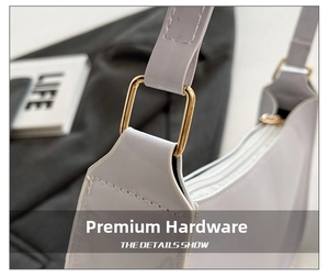 Detail of the high-gloss purple leather shoulder bag with its premium gold square buckle