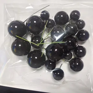 Palline decorative per torte nere lucide in varie dimensioni con steli verdi