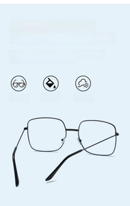 Detail of black large square metal frame glasses with lightweight bridge and nose pads
