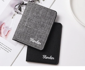 Flat lay of gray and black canvas card holders with textured fabric and Slardar logo