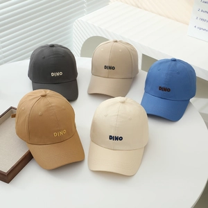Minimalist cotton baseball caps for kids featuring DINO embroidery in five solid colors