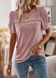 Detail of pink lace embroidery and floral crochet patchwork on women's cotton t-shirt
