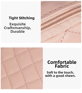 Detail of pink quilted PU leather bag with precise stitching and metal zipper