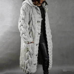 Detailed view of dark grey chunky cable knit cardigan with large buttons and textured pattern