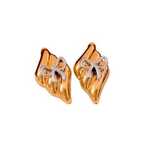 Elegant two-tone wavy gold earrings featuring a stylish 3D silver bow knot design