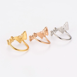 Detailed view of butterfly rings in gold, silver and rose gold with hollow design