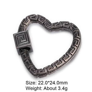 Macro view of gunmetal heart-shaped clasp with Greek key pattern and cubic zirconia