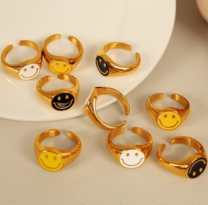 Detailed view of 18K gold plated smiling face open rings with colorful enamel drips