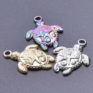Detailed relief of sea turtle pendants in rainbow, gold, and silver stainless steel