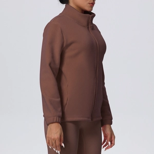 Detail view of brown fleece sports jacket with stand-up collar and secure zipper closure