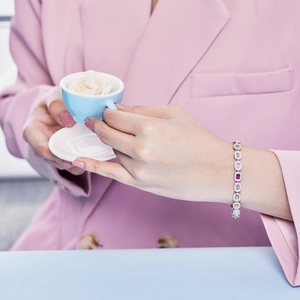 Close-up of S925 silver bracelet with colorful cubic zirconia on woman's wrist