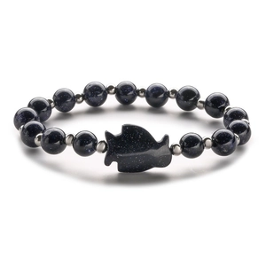 Blue goldstone beaded bracelet with silver fish charm and shimmering natural agate stones