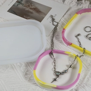 Oval resin jewelry tray silicone mold with DIY colorful resin crafts and silver necklace