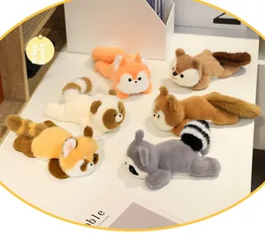 Close-up of assorted plush forest animals including raccoon and fox in prone style