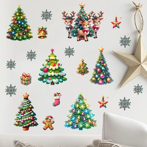 Detailed view of colorful Christmas wall stickers with reindeer and pine trees on a white wall