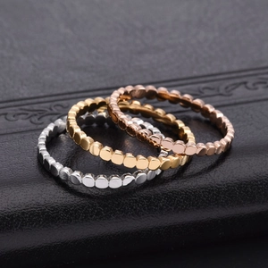 Three-piece set of minimalist beaded stainless steel rings in silver, gold, and rose gold