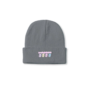 Close-up of grey knit beanie with four cartoon bears and Japanese text embroidery