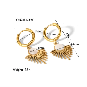 Detailed view of gold sunburst earrings with white inlay and precise measurements