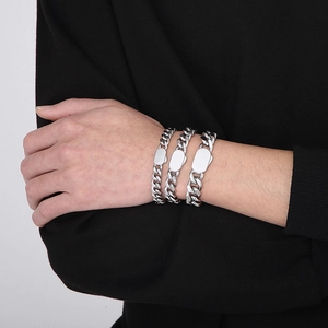 Three-piece set of silver Cuban chain bracelets with engraved rectangular plates