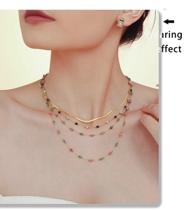 Wearing effect of a layered gold PVD titanium necklace with colorful lapis stone beads