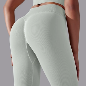 Detail view of high-waisted seamless yoga leggings with scrunch butt lift in light sage green
