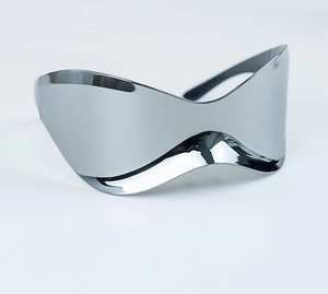 Close-up of futuristic silver mirrored wrap-around sunglasses with Y2K metallic finish