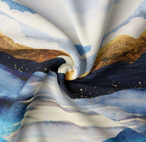 Close-up of abstract blue and gold mountain tapestry fabric with soft star patterns