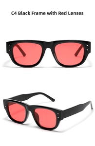 Detail view of square black frame sunglasses with red lenses and silver metal rivets