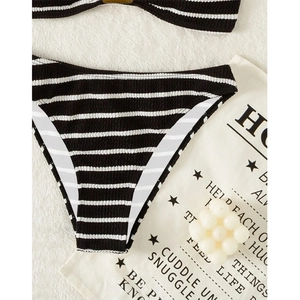 Detail shot of black and white striped bikini bottom with textured seersucker fabric finish