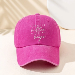 Pink washed cotton baseball cap with Life is Better white embroidery on front