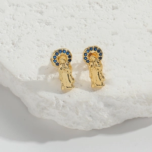 Detailed macro view of gold Virgin Mary earrings featuring blue zircon halo accents