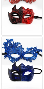Detail view of lace phoenix mask and painted gold-dusted masquerade party masks